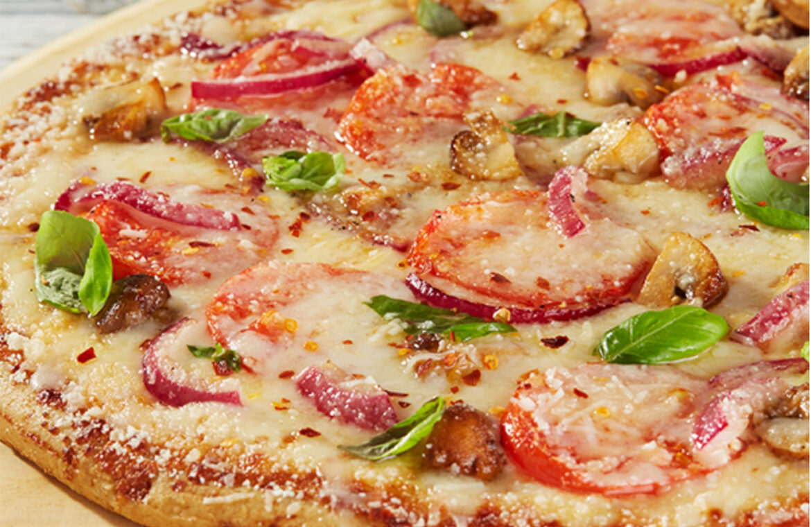 Pizza Topped with Tomatoes and other ingredients