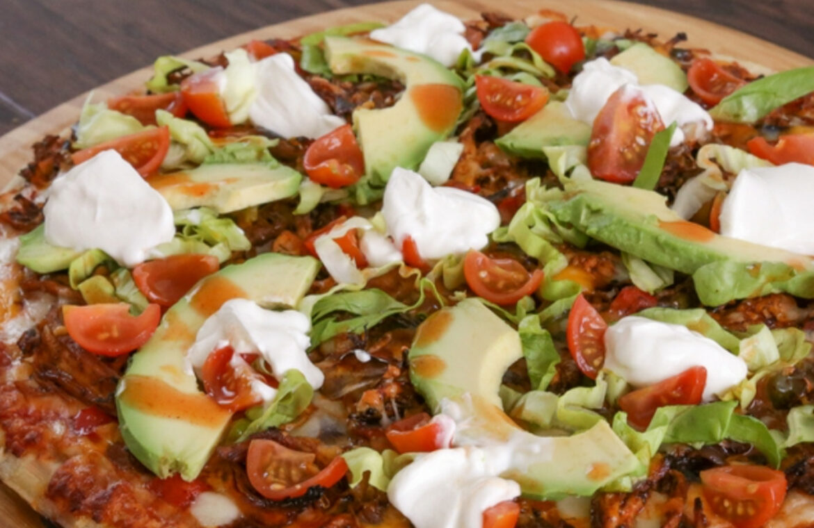 Pizza topped with enchilada ingredients