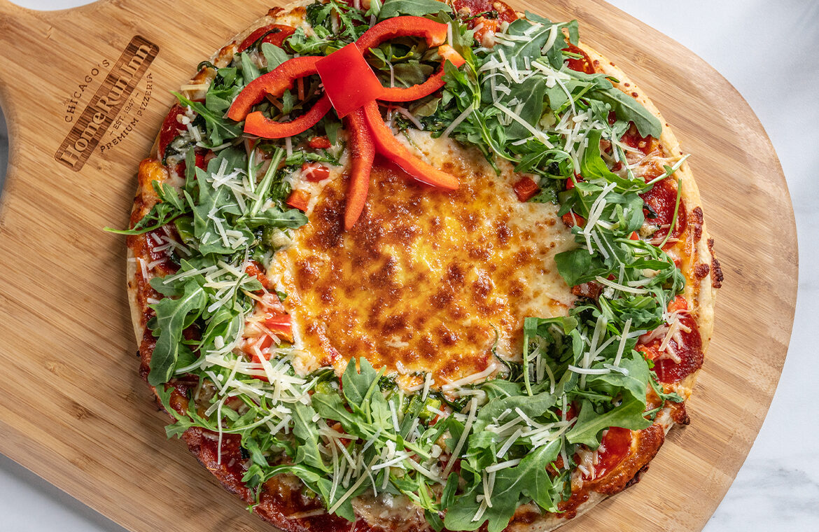 Pizza with toppings in the shape of a winter holiday christmas wreath