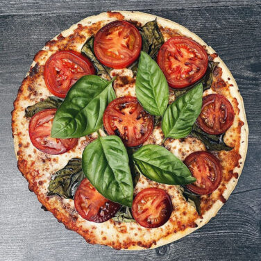 Margherita Pizza with fresh basil and tomatoes