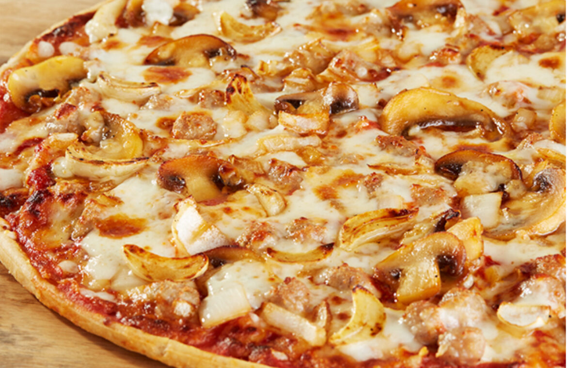 Sausage pizza topped with garlic and other ingredients