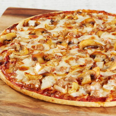 Sausage pizza topped with garlic and other ingredients