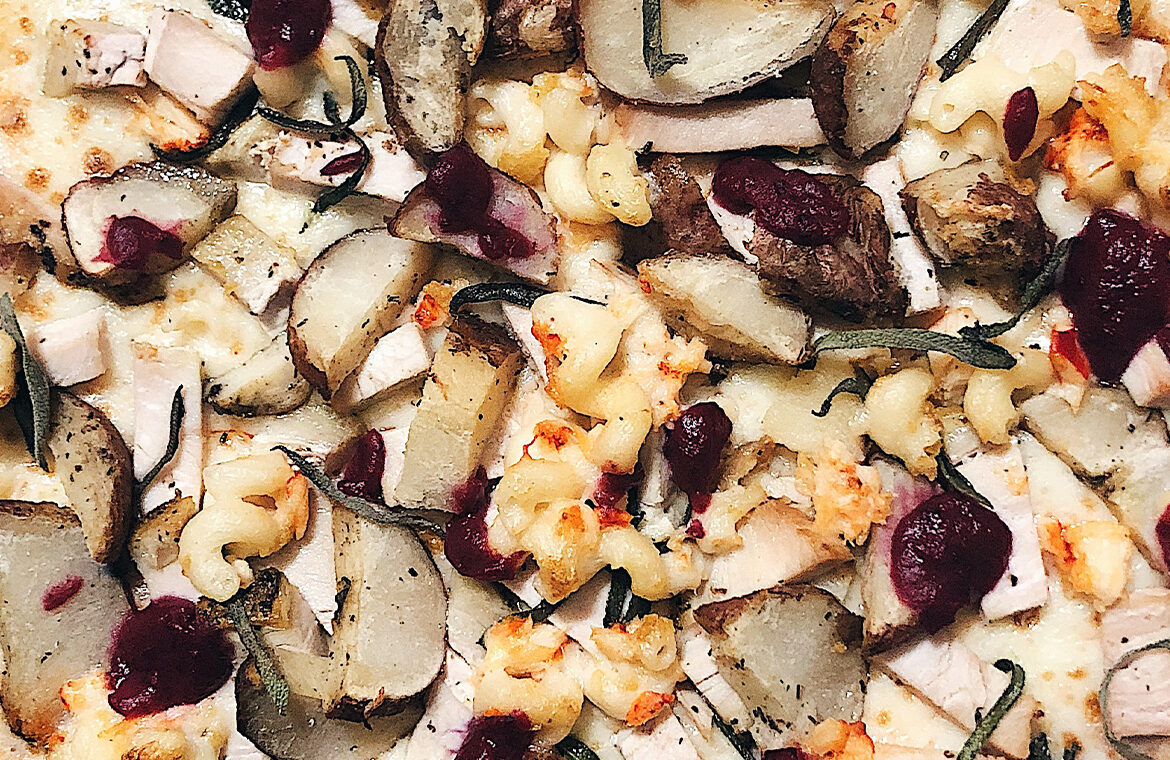 Pizza topped with Thanksgiving leftovers