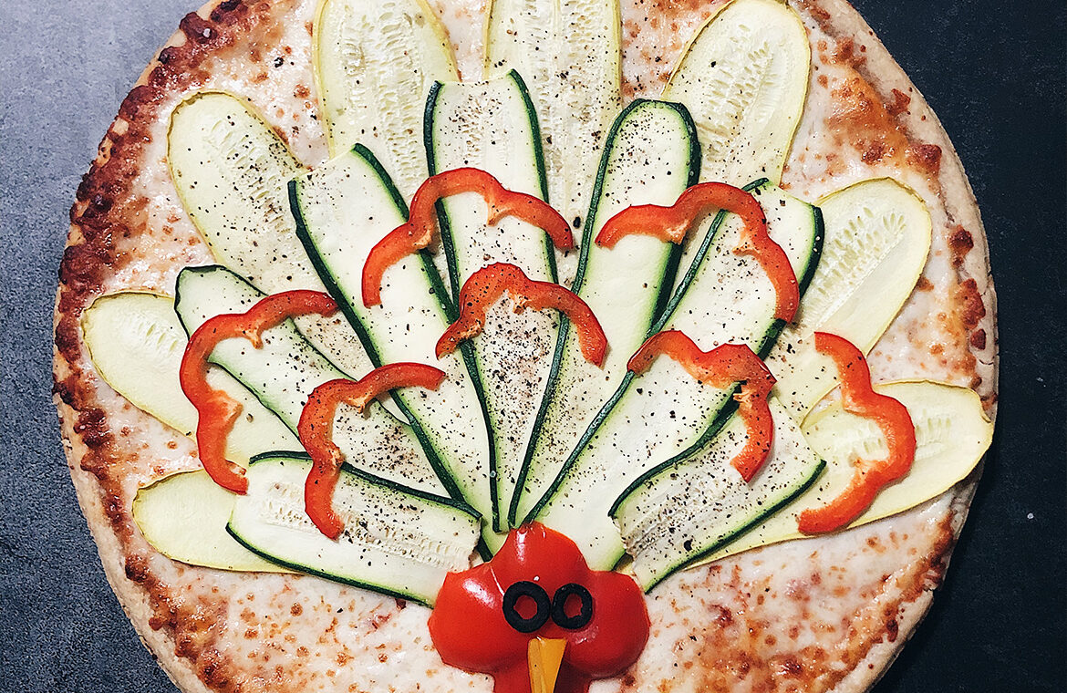 Pizza with vegetables in the shape of a turkey