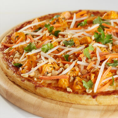 Pizza Topped with Chicken and Sriracha