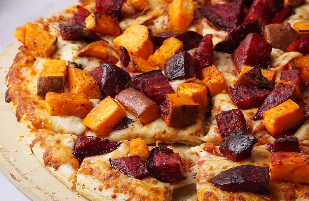 Pizza topped with beets and sweet potatoes