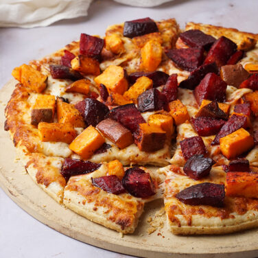Pizza topped with beets and sweet potatoes