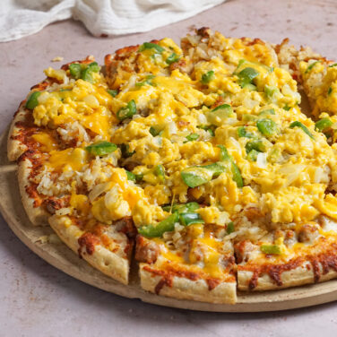 Pizza topped with egg scramble