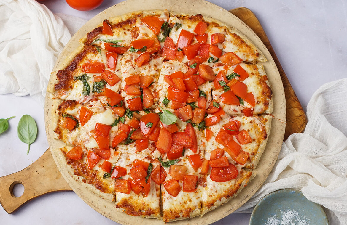 Pizza topped with bruschetta
