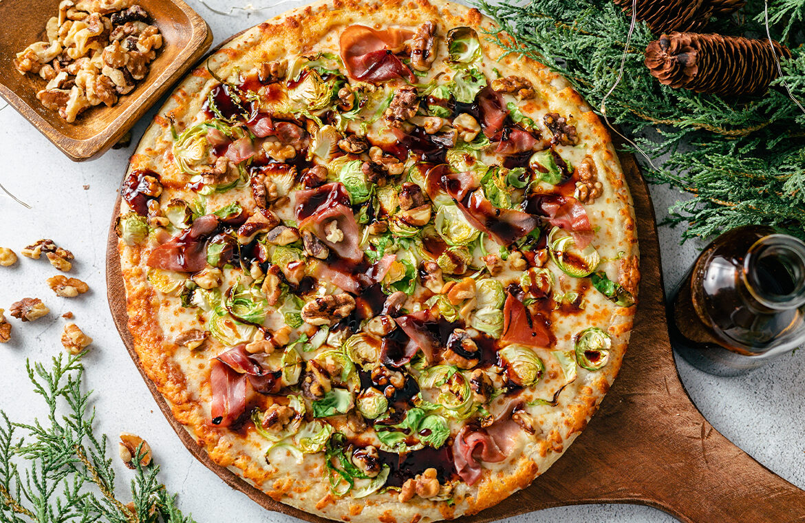 Pizza topped with brussels and prosciutto