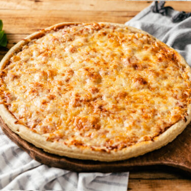 Pizza topped with cheese