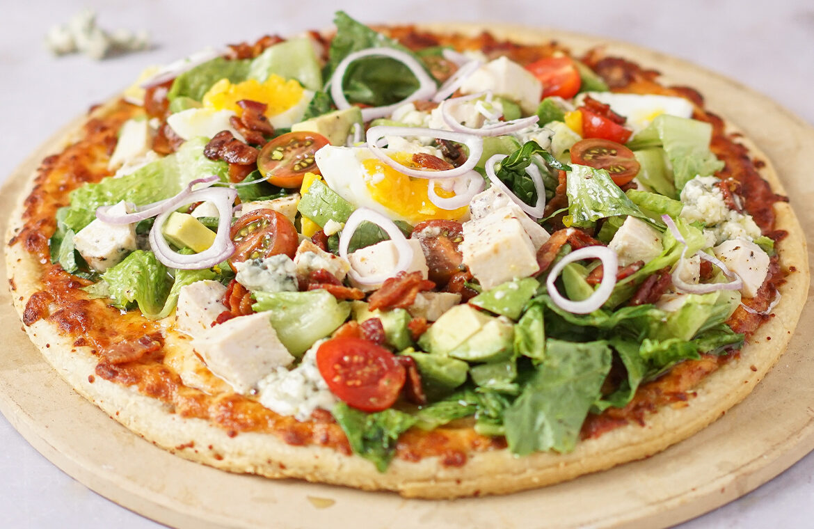 Pizza topped with cobb salad ingredients