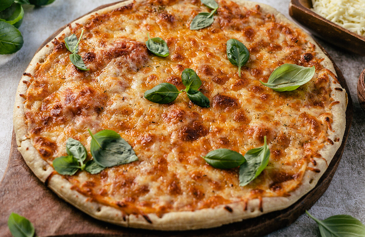 pizza topped with dairy-free cheese and basil