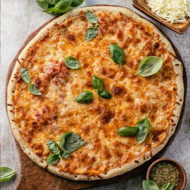 pizza topped with dairy-free cheese and basil