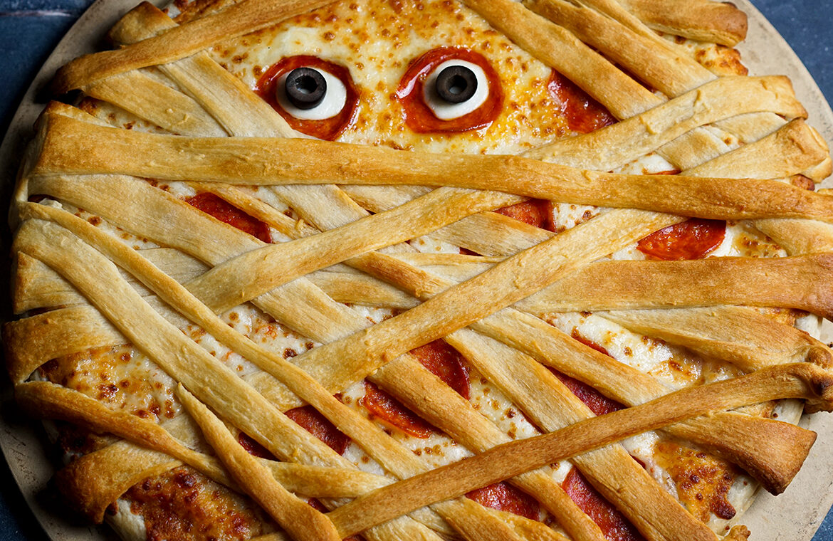 Pizza covered in crescent dough resembling a mummy