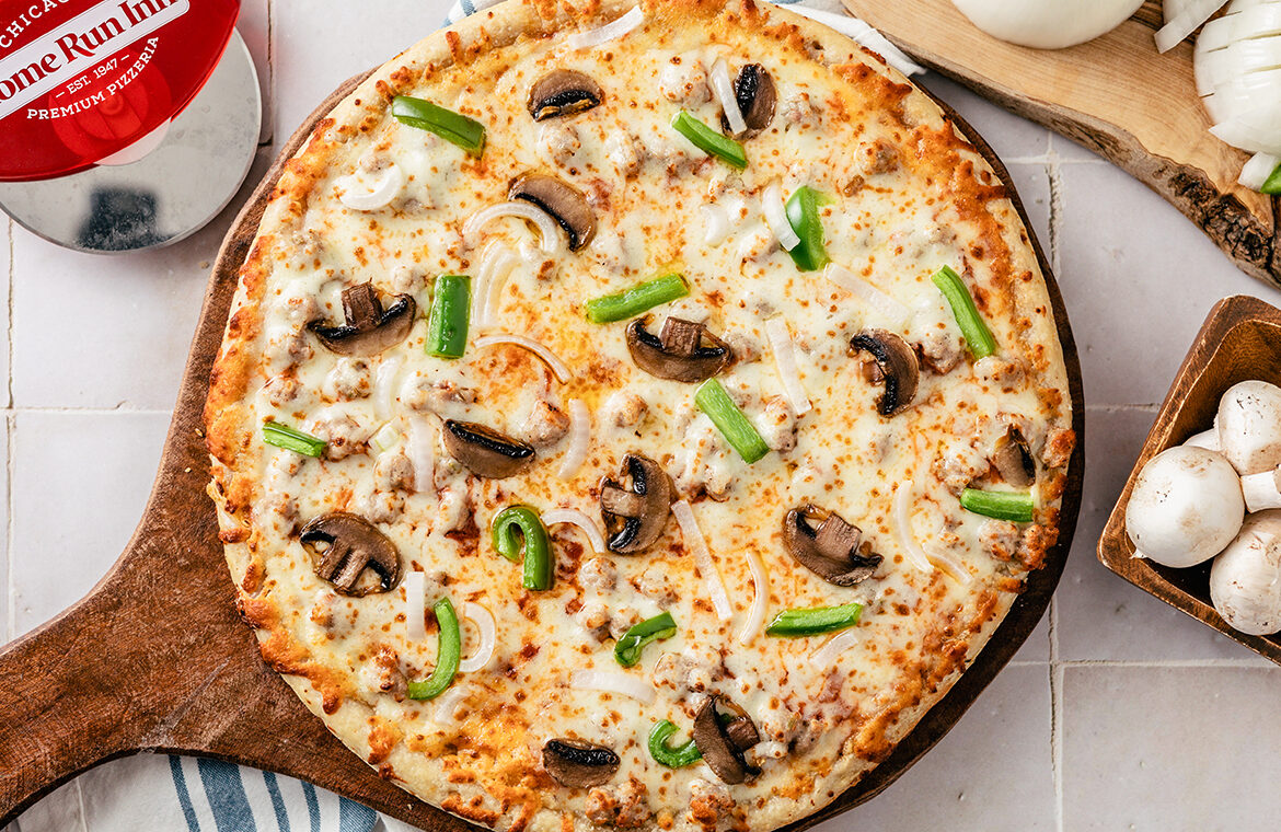 Pizza topped with mushrooms and peppers