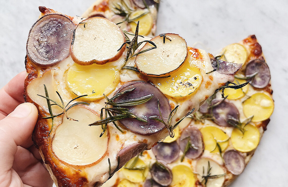 Pizza topped with potatoes and rosemary