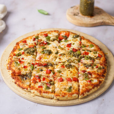 Veggie Pizza topped with pesto