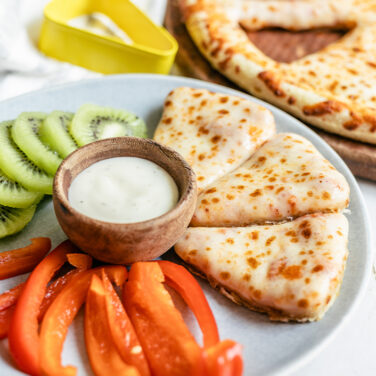 Pizza cut into snack triangles with triangle cookie cutter