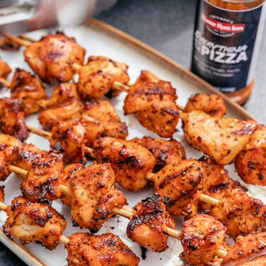 Grilled chicken skewers seasoned with pizza spice