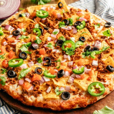 Pizza topped with nacho ingredients