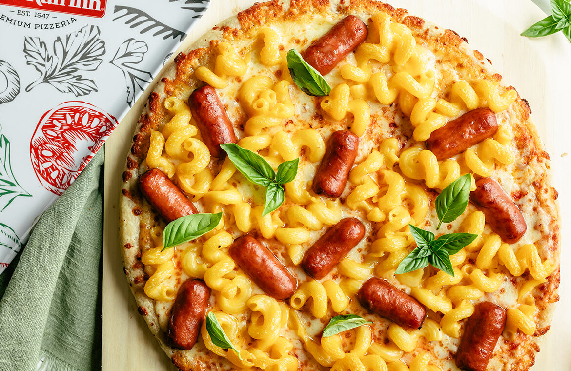 Baked pizza topped with mac n' cheese and lil' smokies