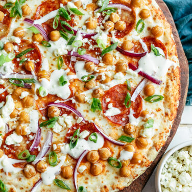 Baked Pizza Topped with chickpeas, onions and more
