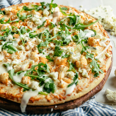 Baked pizza topped with recipe ingredients