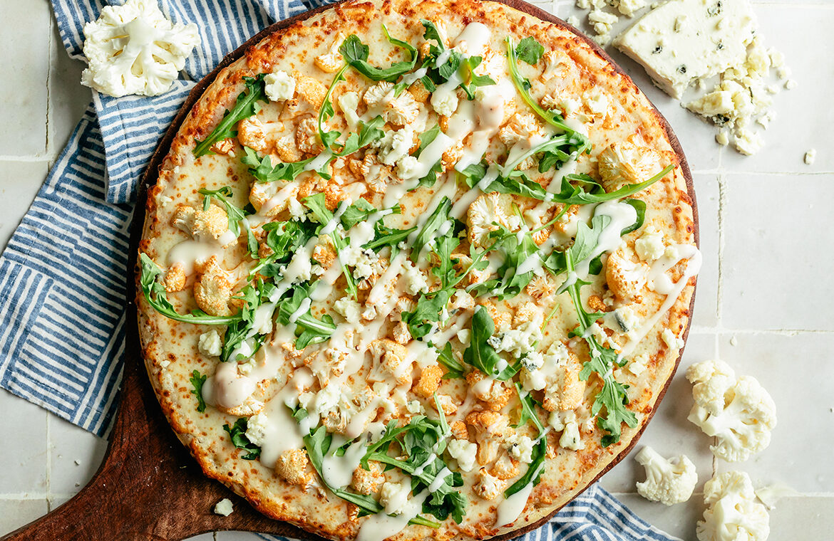 Baked pizza topped with recipe ingredients