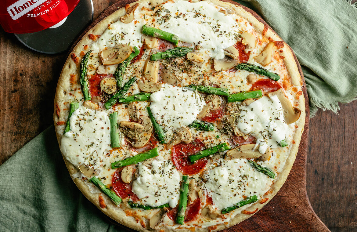 Baked pizza topped with recipe ingredients