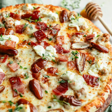 Baked pizza topped with recipe ingredients