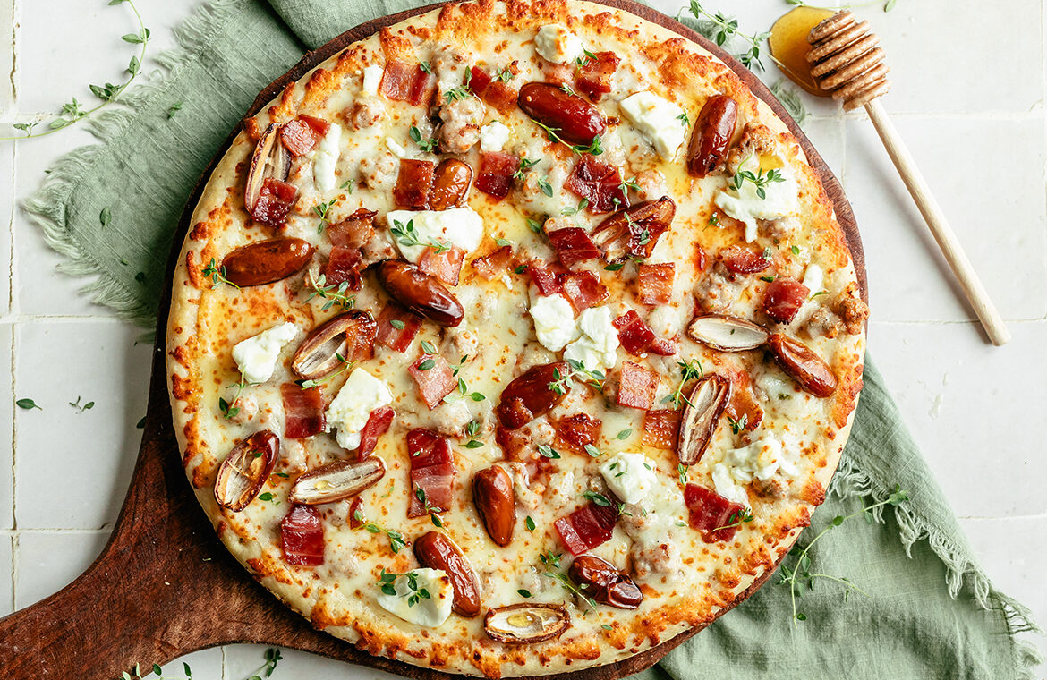 Baked pizza topped with recipe ingredients