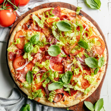 Baked pizza topped with recipes ingredients