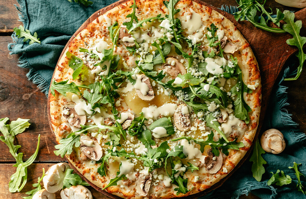 Baked pizza topped with recipe ingredients