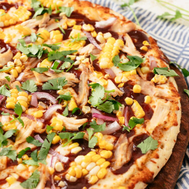 Baked pizza topped with corn and other ingredients from the recipe