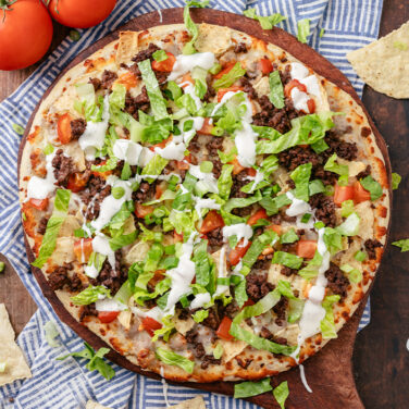 Baked pizza with recipe ingredients on top