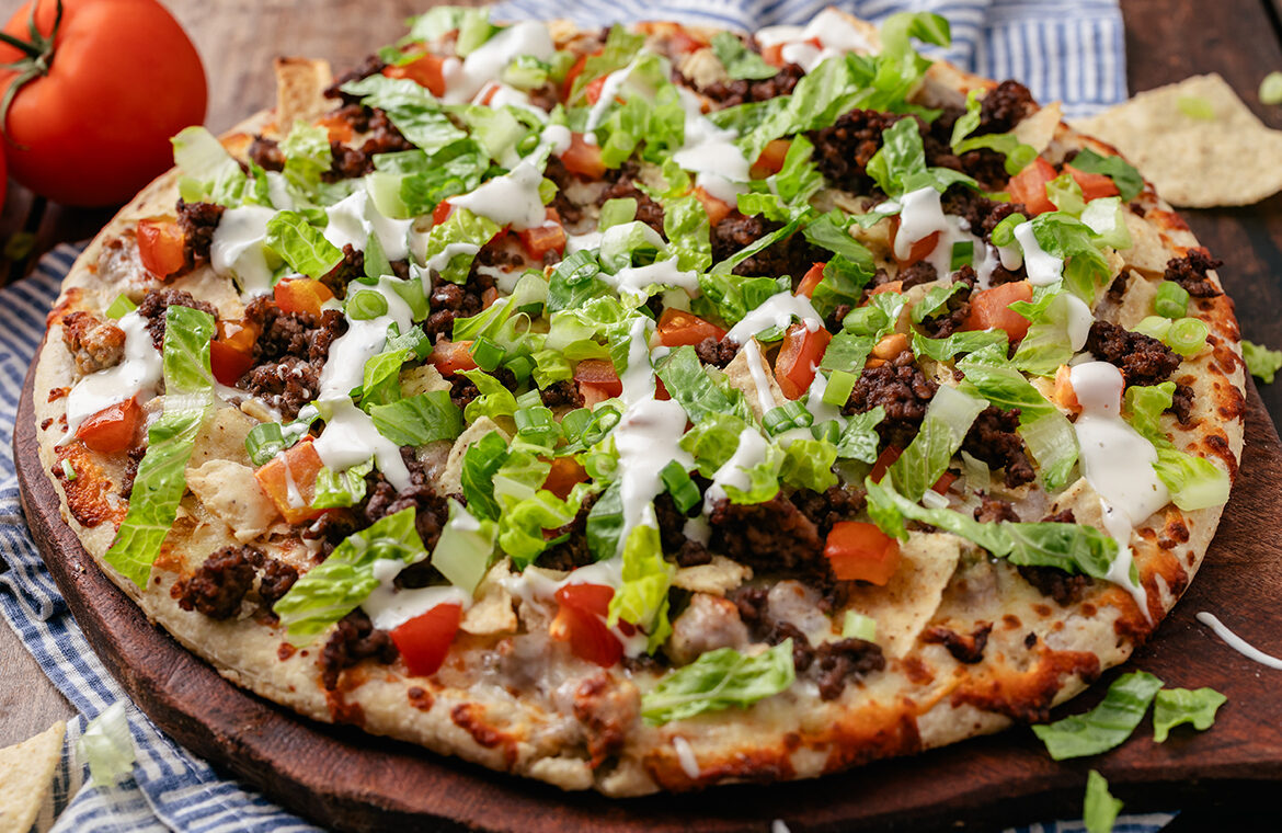 Baked pizza with recipe ingredients on top