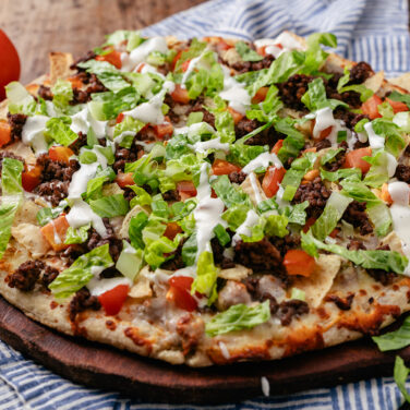Baked pizza with recipe ingredients on top
