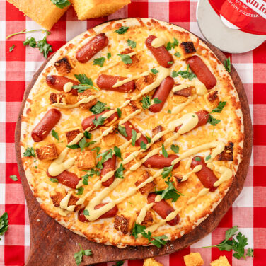 Baked pizza with recipe ingredients on top