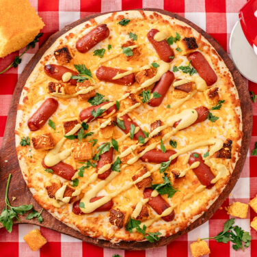 Baked pizza with recipe ingredients on top