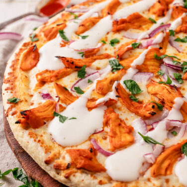 Baked Home Run Inn Pizza with recipe ingredients on top