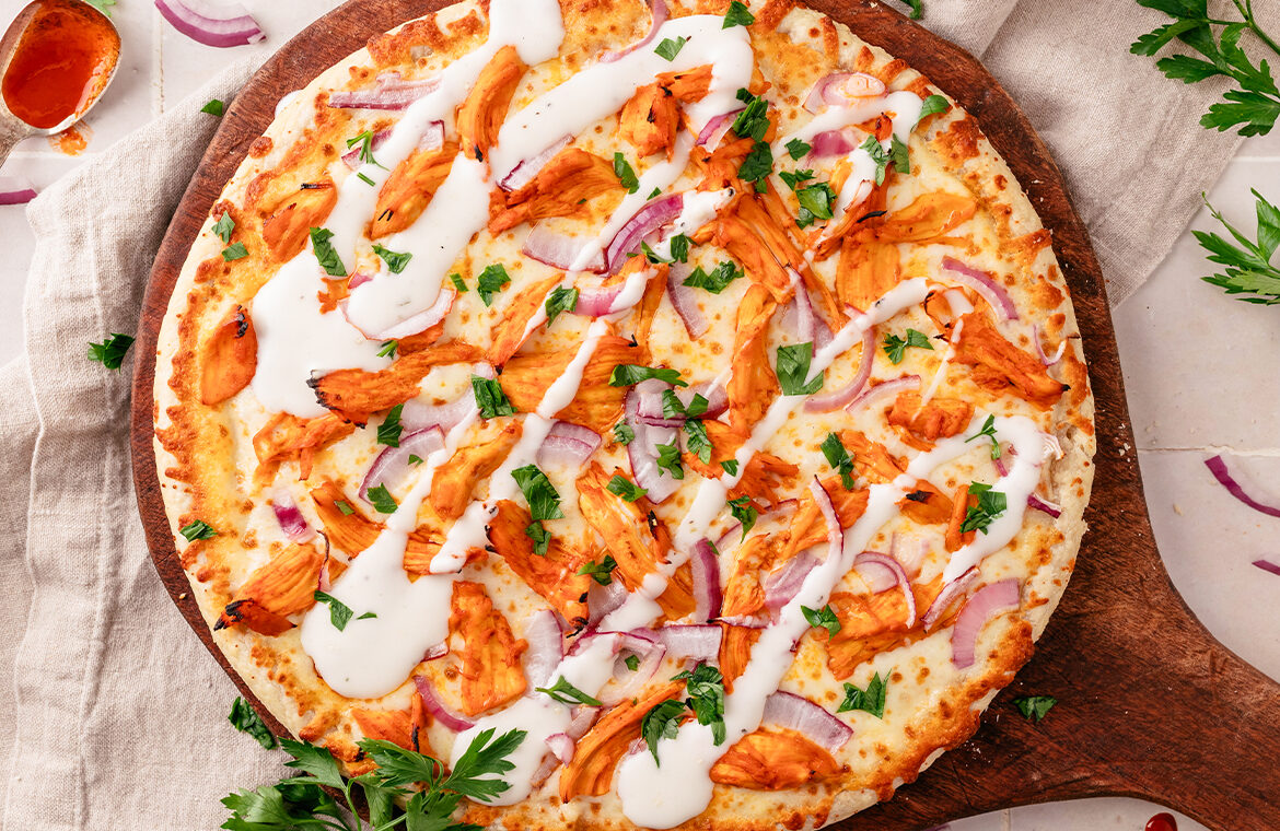 Baked Home Run Inn Pizza with recipe ingredients on top