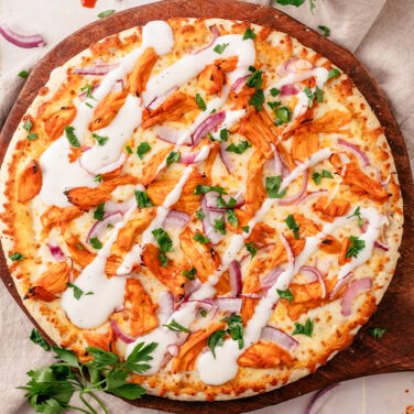Baked Home Run Inn Pizza with recipe ingredients on top