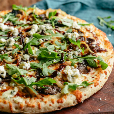 Baked Home Run Inn Pizza with recipe ingredients on top