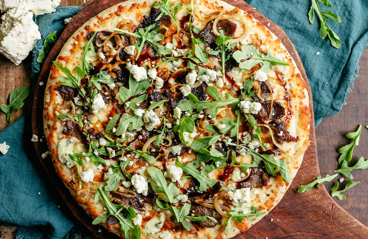 Baked Home Run Inn Pizza with recipe ingredients on top