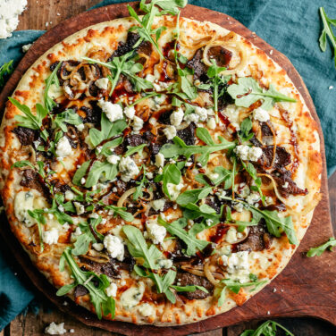 Baked Home Run Inn Pizza with recipe ingredients on top
