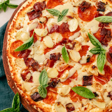 Baked Home Run Inn Pizza with recipe ingredients on top