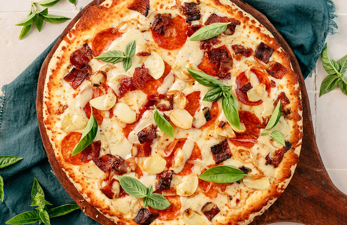 Baked Home Run Inn Pizza with recipe ingredients on top