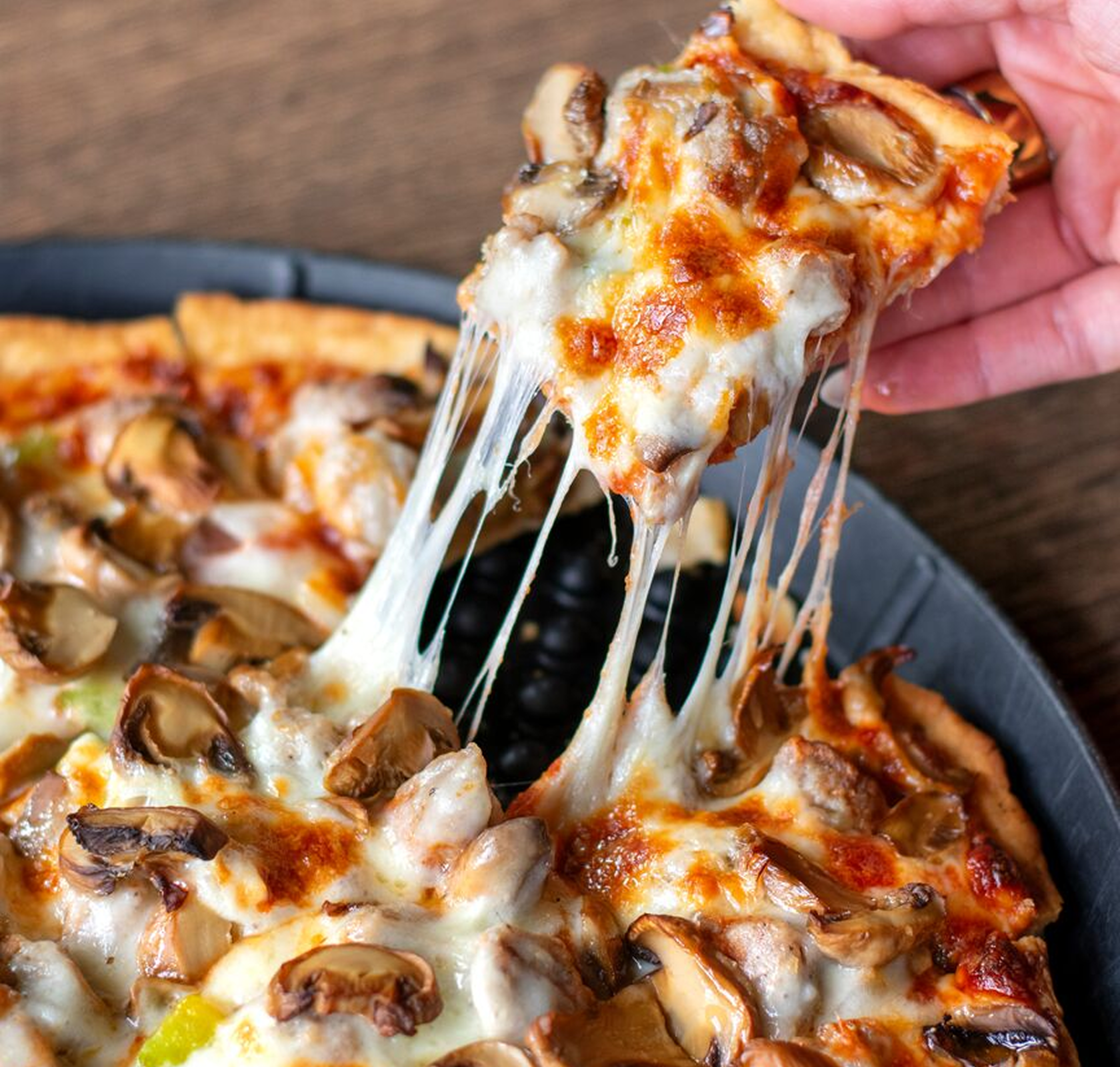 Image-Pizzas the 1947 pizza with a cheese pull