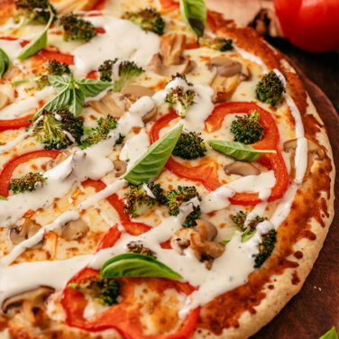 Baked Home Run Inn Pizza with recipe ingredients on top